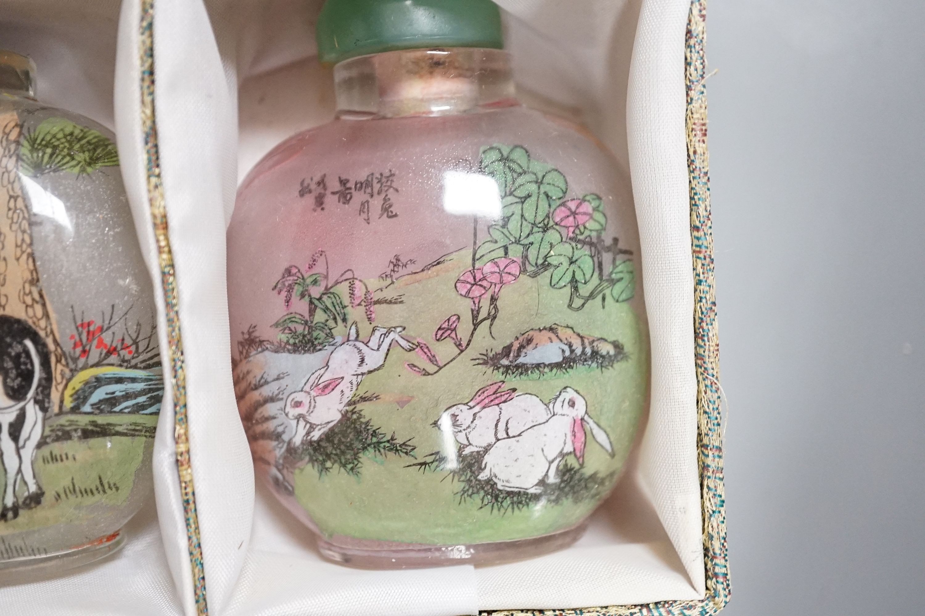 A boxed set of six Chinese inside-painted snuff bottles, height 8cm overall